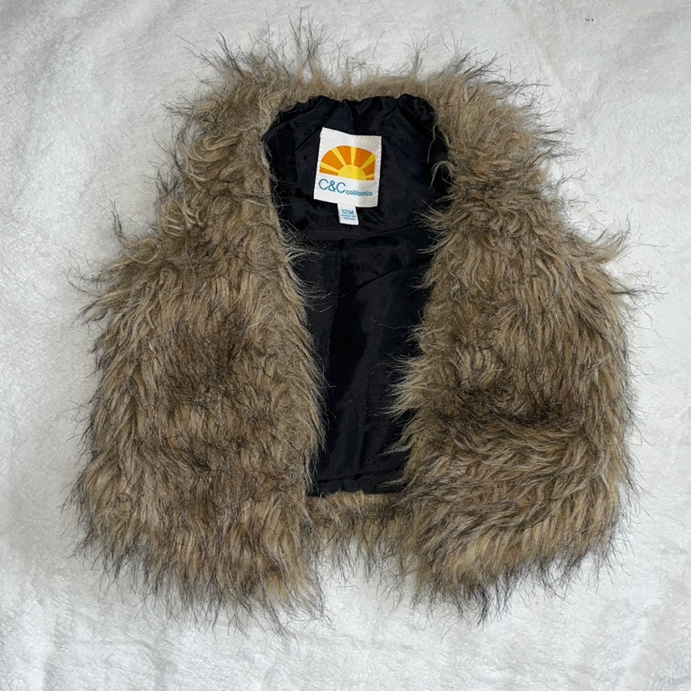Little girl furry vest